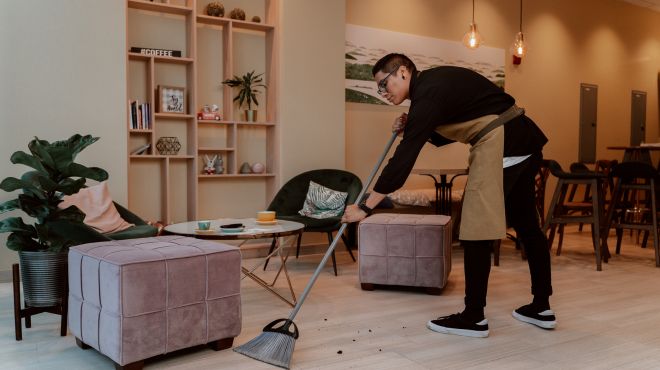 man dream of himself sweeping floor in his house