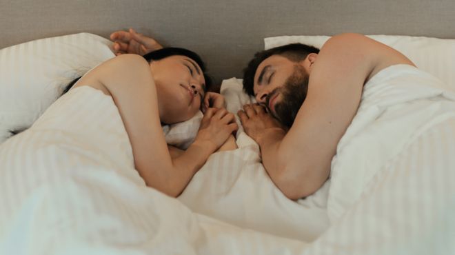 couple sleeping together at night