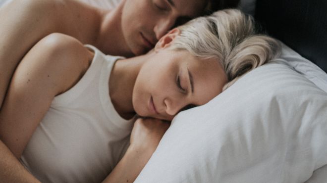 man dreaming his girlfriend sleeping with him in past