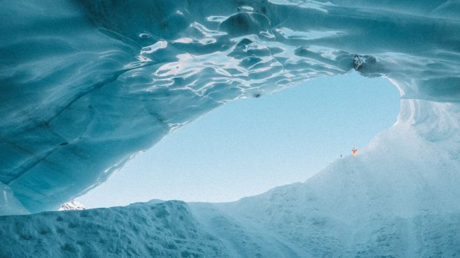 man dreams about the sky opening while he is in a ice cave