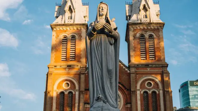 virgin Mary statue in front a church