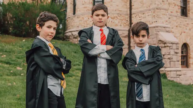 kids dreaming about himself wearing a black cloak in his graduation