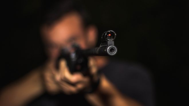 man dream about someone pulling a gun at him at a distance