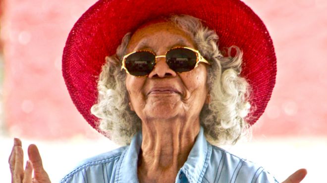 old women wearing a red ant and sunglasses in dreams