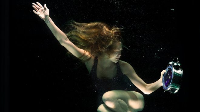women dreaming of a specific time traveling under water