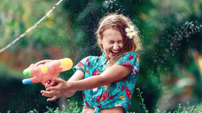 children throwing water and enjoying in dreams